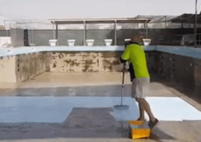 Video Showing An Immaculate White Paint Job Of A Large Empty Concrete Swimming Pool